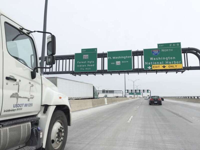 Signs for Exit 2 (Interstate 295 North, Washington, National Harbor) and Exit 3 (Maryland State Route 210, Forest Heights, Indian Head) on the Woodrow Wilson Bridge (northbound Interstate 95 and the eastbound outer loop of the Capital Beltway