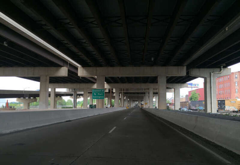 View south along Maryland State Route 2 Truck (McComas Street) at Cromwell Street underneath Interstate 95 in Baltimore City, Maryland