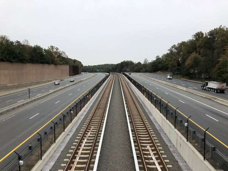 View east along Virginia State Route 267 (Dulles Toll and Access Roads) and the Silver Line of the Washington Metro from the overpass for Virginia State Route 676 (Trap Road) in Wolf Trap, Fairfax County, Virginia