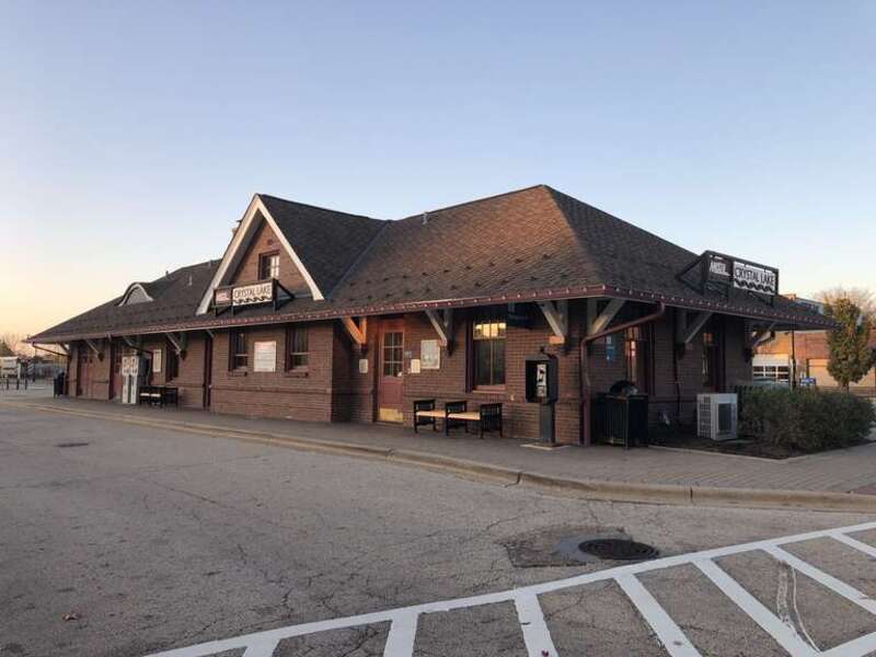 The Metra Northwest Line train station at Crystal Lake, Illinois. Looking north toward the station from its south corner.  October 27, 2019.