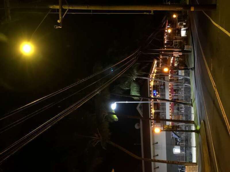 Yellow and orange street lights along Ali'i Drive in Kailua-Kona, Hawaii County, Hawaii