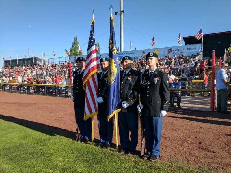 Members of the Oregon National Guard Honor Guard present the colors at the 10th Annual Patriotic Tribute at the Volcanoes Stadium in Keizer, Oregon, July 4, 2017. This year marked the 10th Annual Patriotic Tribute honoring Service Members and fallen