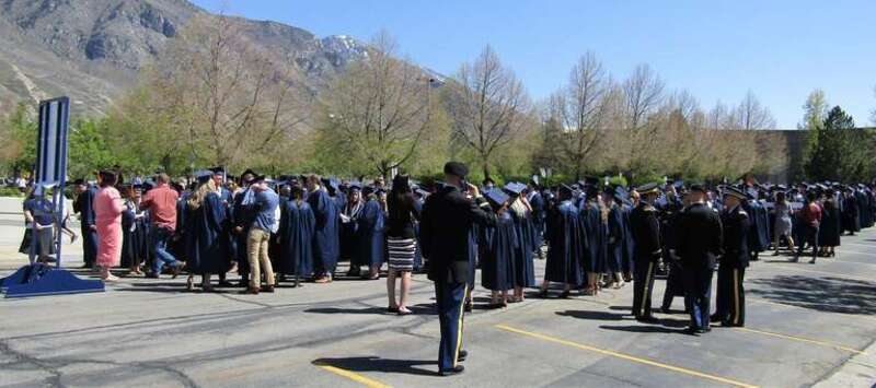 BYU graduates waiting to march to the Marriott Center for Commencement.