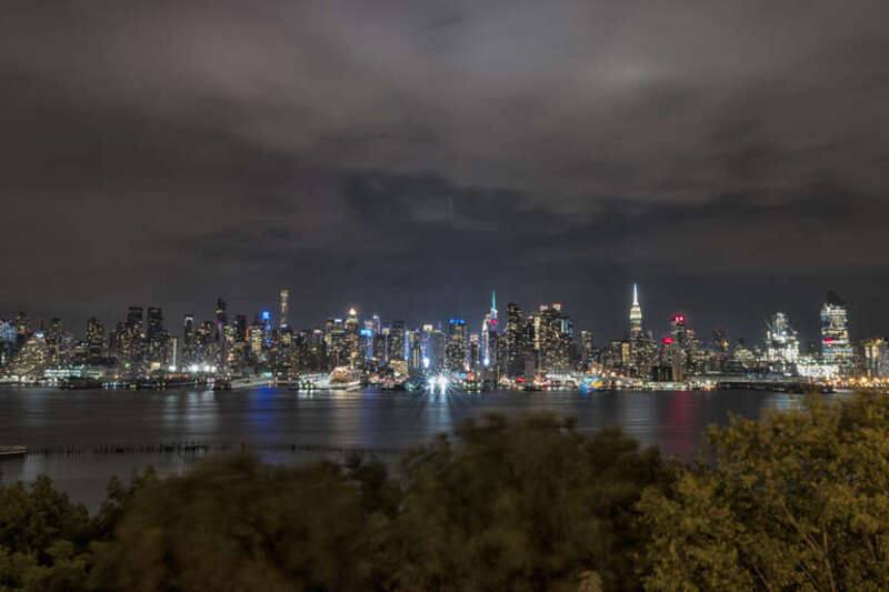 500px provided description: Manhattan from Hamilton Park, in New Jersey. A few minutes before the flood [#park ,#trees ,#city ,#water ,#river ,#travel ,#night ,#clouds ,#cloudscape ,#architecture ,#cityscape ,#lights ,#ny ,#new york ,#beautiful