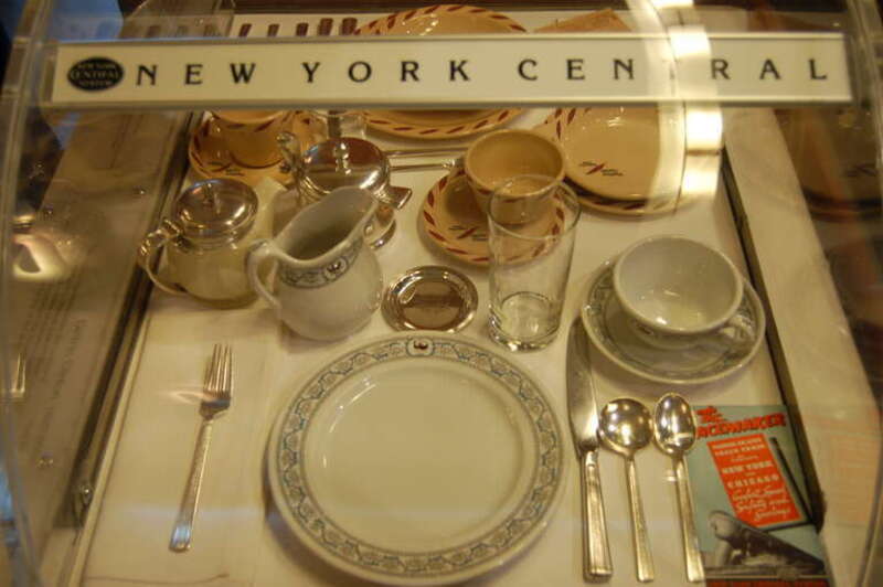 New York Central dinner ware from the Pacemaker. Perhaps 1930's to 1950's.  The service at the top with little feathers is from the Western Pacific, which made up the other half of this table top display.