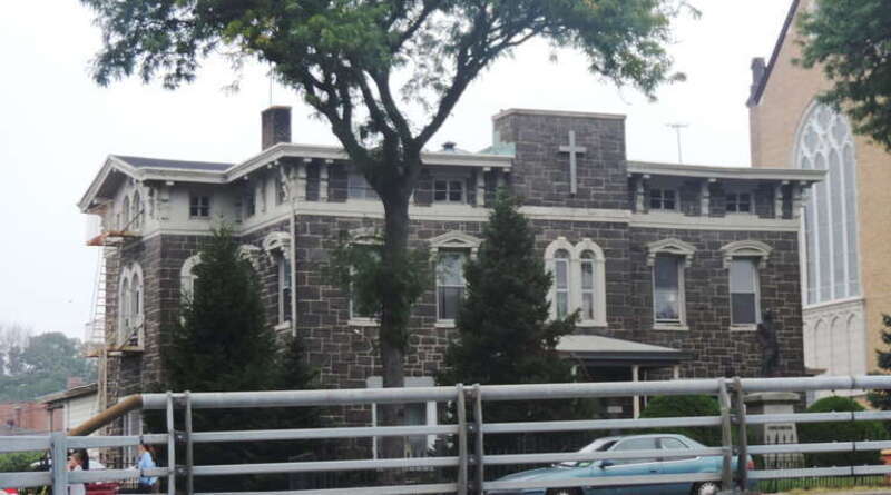 Looking west at rectory on a cloudy day.