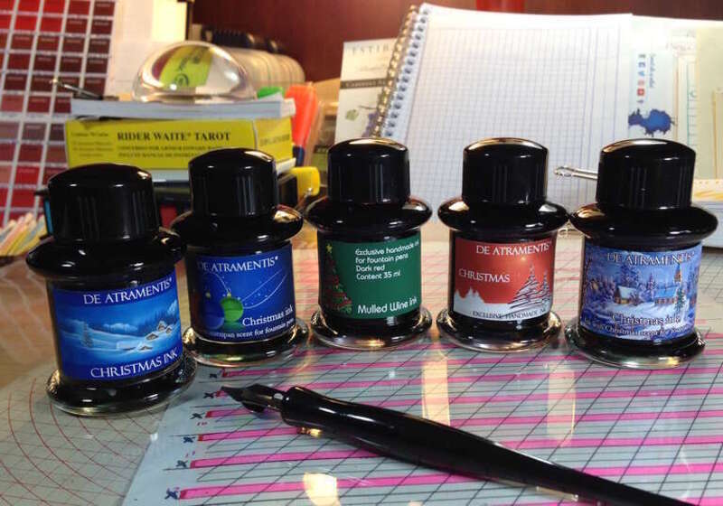 Image of a set of ink bottles with de Atramentis scented fountain pen inks.
