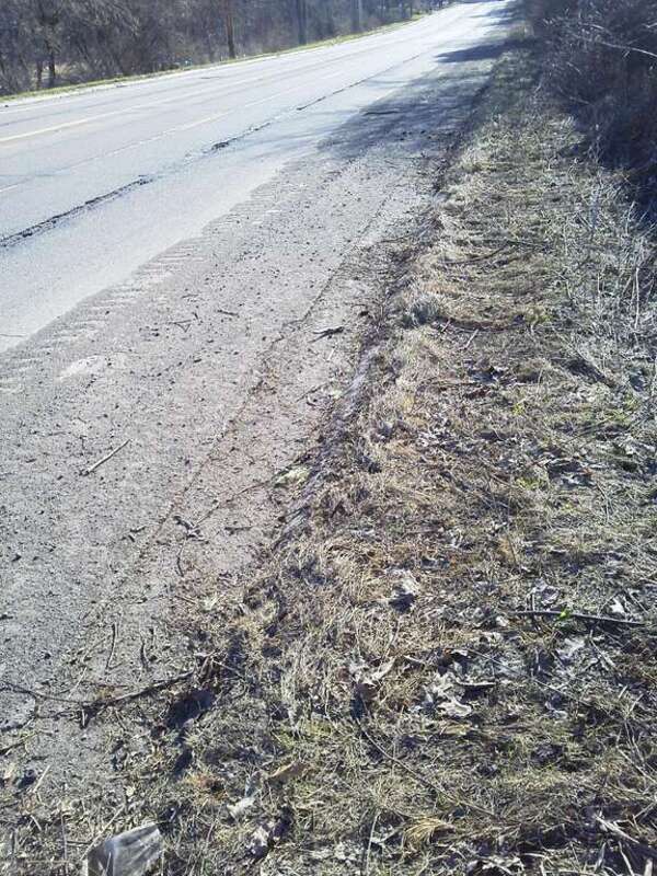 Gravel and dirt in a designated bicycle lane, Mount Hope Avenue, Michigan, April 2011.
