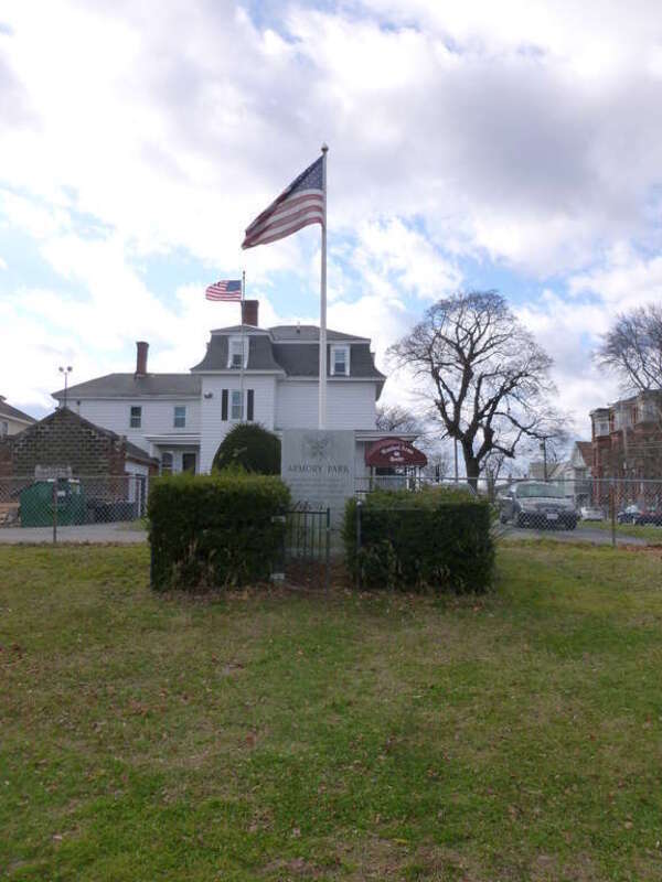 Whole view of the dedication monument for Armory Park.  The monument is located on the west end of the park.