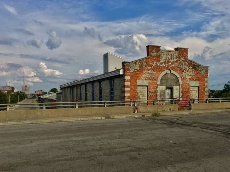 The former Erie Railroad freight depot, 391 Exchange Street (as seen from the Louisiana Street overpass bridge over Interstate 190), Buffalo, New York, August 2020. It's not entirely clear when this long, slender brick edifice was constructed - this