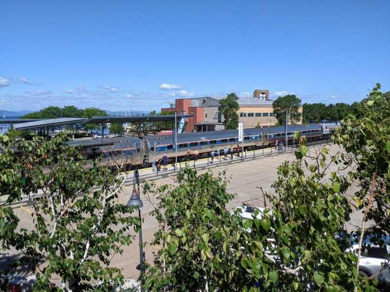 The waiting southbound Ethan Allen Express viewed from the station patio at Burlington.
