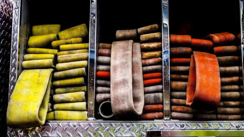Fire hose on a fire truck in Glendale California. 3 packs of water hose .