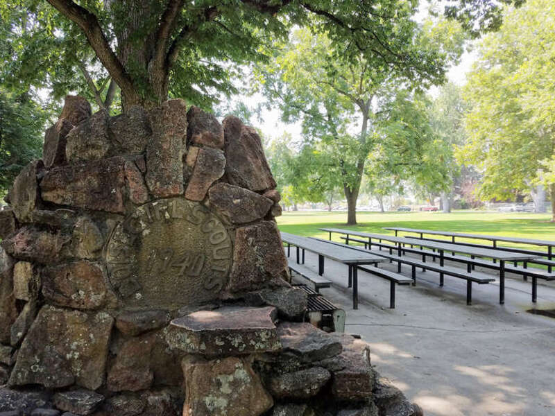 A marker for Boise Girl Scouts decorates a picnic area fire pit at Kristin Armstrong Municipal Park.