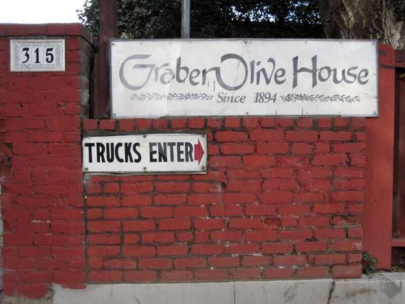 Photo of the signage in front of the Graber Olive House, 315 E 4th St, Ontario, CA 91764. In 1894, two years after planting olive trees in Ontario, California, C. C. Graber began selling vat cured olives. Graber Olive House is the oldest operating