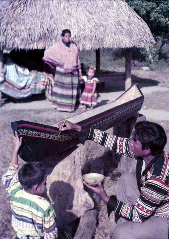 Local call number: N049197
Title: Harry Jumper paints an Indian war canoe: Hollywood, Florida
Date: 1955
General note: The photograph was taken at the Dania Seminole Indian Reservation. The canoe was made as a trophy to the winner of the