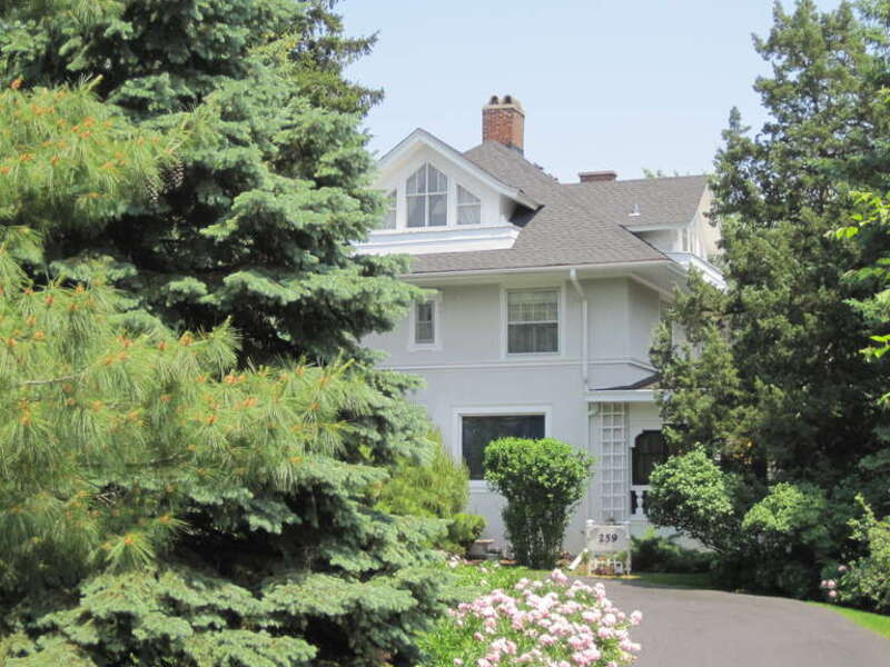 John L. Pentecost House in Elmhurst (1910). It was built in 1888 as a Queen Anne house, but was extensively remodeled in 1910 with a mixture of architectural styles. It was built for Miss Rebecca Richardson, paid from an inheritance from her former