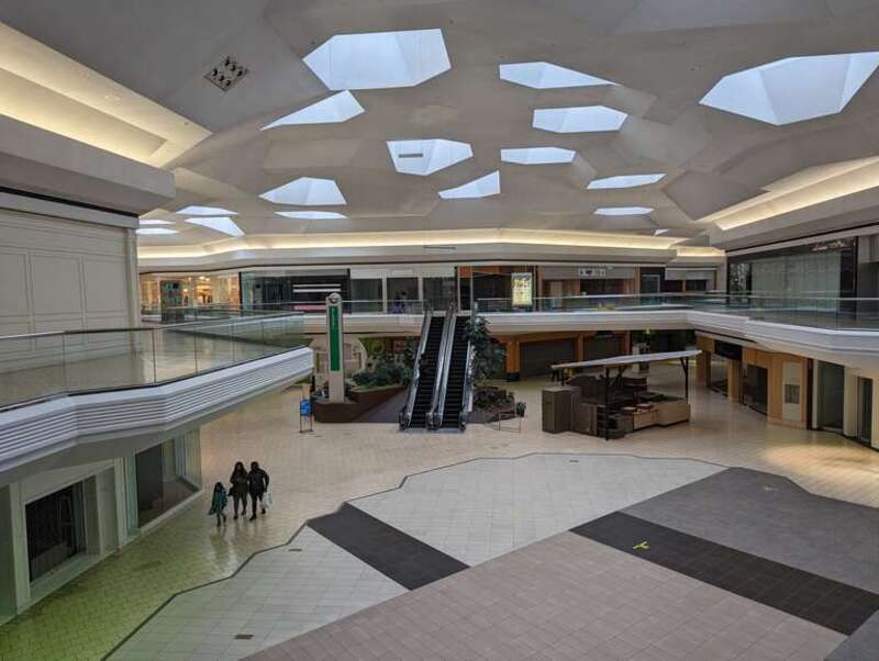 The center court and the escalators at Lakeforest Mall. The information booth is to the left of the escalators. Almost all of the stores are now closed. 701 Russell Avenue, Gaithersburg, Maryland.