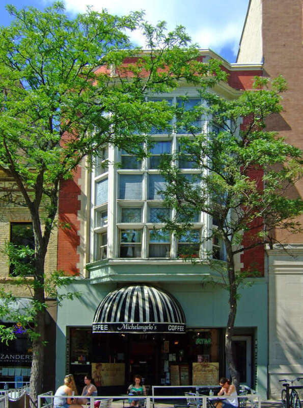 The Lamb Building (1905) at 114 State Street in Madison, Wisconsin, was added to the National Register of Historic Places in 1984.  With its two-story bays, leaded glass detail, and original Carroll Street storefront, this is one of Madison's best