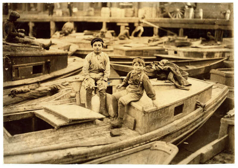 Fisher Boys Playing Truant on their Father's Smacks. Location: Boston, Massachusetts. Photograph by Lewis Wickes Hine, October 1909.

From the National Child Labor Committee Collection at the Library of Congress