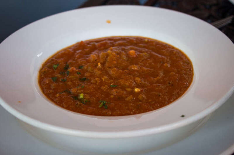 Jane's entree at Ralph Brennan's Jazz Kitchen: Louisiana Soup of the Day - Chef's Creation. I know it was some type of tomato soup, but I don't remember the specifics.