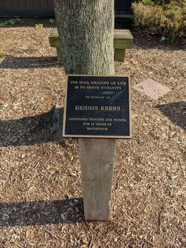 A black plaque in remembrance of Dennis Krebs MacArthur Middle school