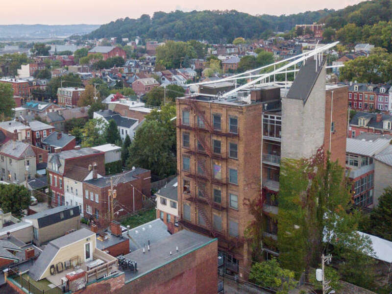 The Mattress Factory main building with light installation &quot;Acupuncture&quot; by Hans Peter Kuhn.