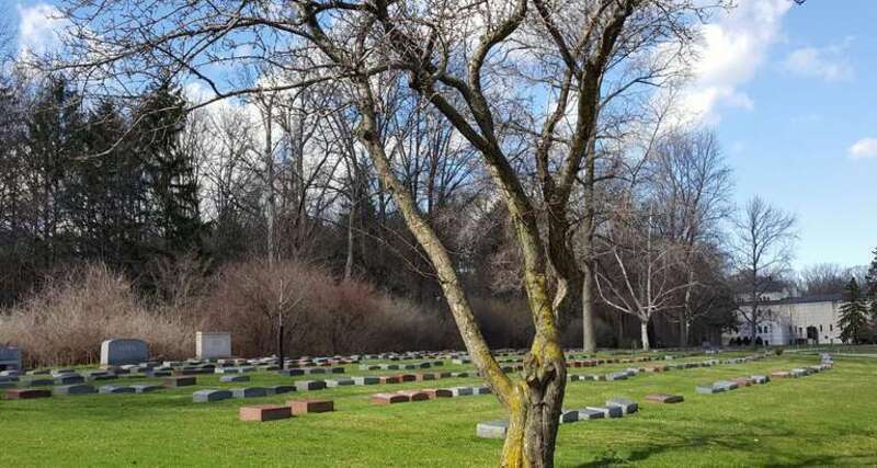 A view of the west side of Mayfield Cemetery in Cleveland Heights, Ohio.  Mayfield is a Jewish cemetery adjacent to Lake View Cemetery.  The mausoleum can be seen in the distance, right.