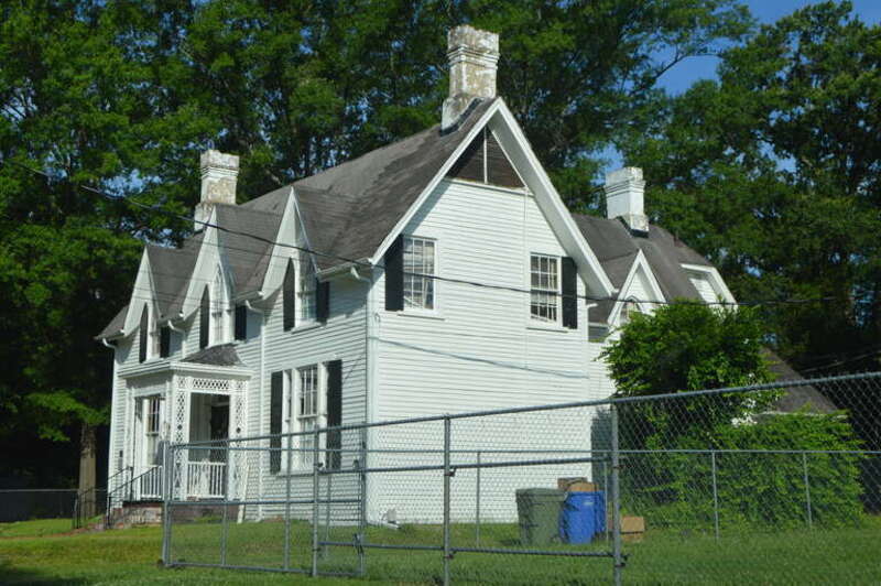 Front and eastern side of the Moses Rountree House, located at 107 N. Rountree Street in Wilson, North Carolina, United States.  Built in 1869, it is listed on the National Register of Historic Places.