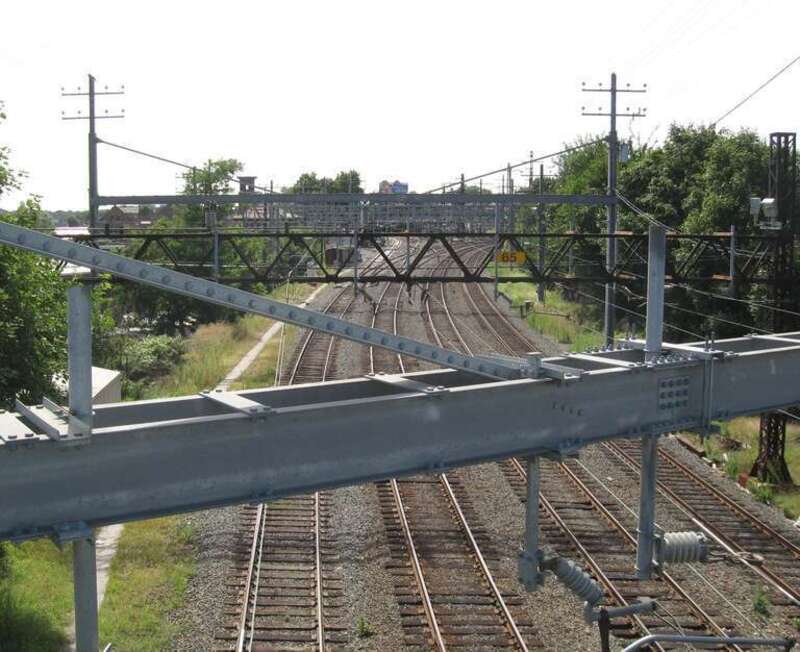Looking southwest from the Centre Avenue overpass immediately south of New Rochelle Station, at the track wye of Amtrak and the NH Line of w:Metro-North Railroad on a sunny midday