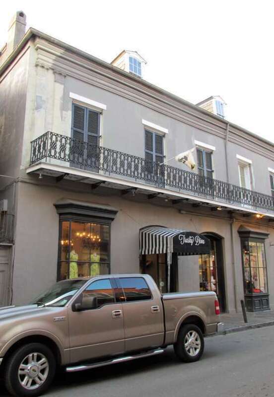 This attractive building on Toulouse Street is next to the Two Lions building.