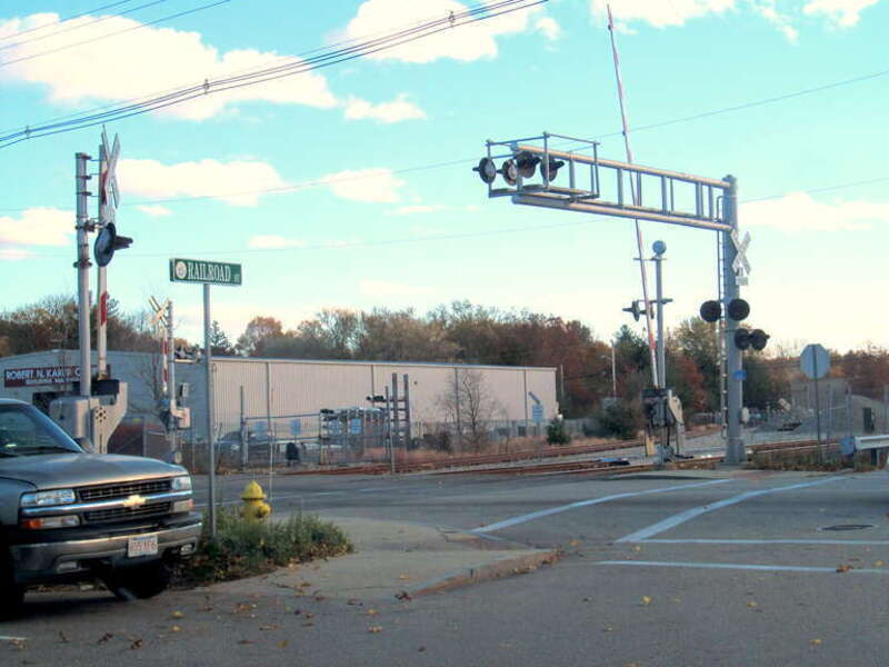 North Avenue grade crossing in November 2016. In 1893, the New Haven Railroad illegally ripped up trolley tracks at the grade crossing, sparking the North Abington Riot. The nearby North Abington Depot was built by the railroad as a peace offering to