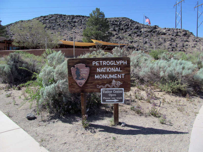 A photo of the entrance sign at the Petroglyph National Monument Visitor Center in Albuquerque, NM.