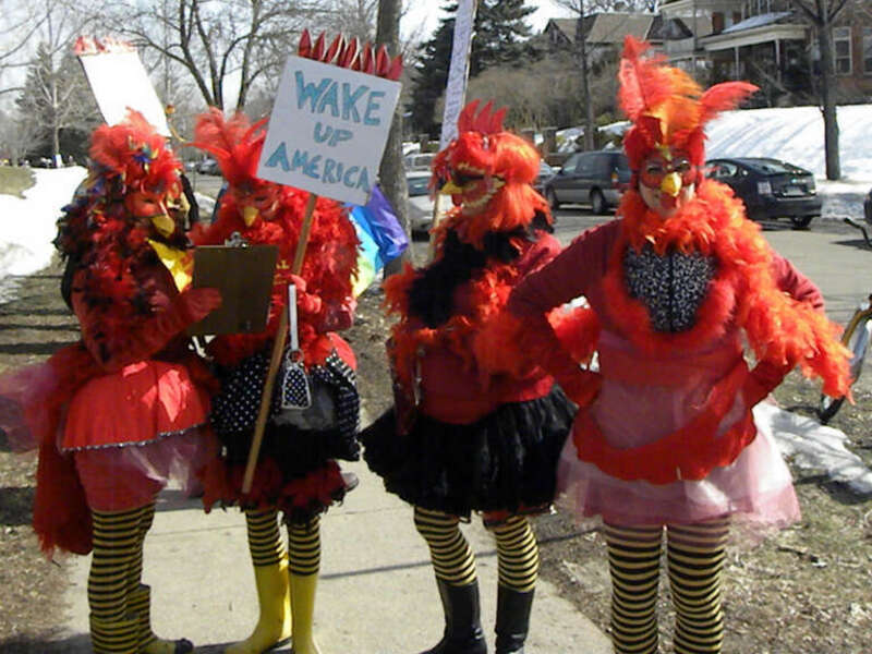 St. Paul, Minnesota
March 19, 2011
Chickens checking their chicken schedule. Protesters marched through St. Paul, down University Avenue and ended with a rally on the steps of the capitol building.

2011-03-19 This is licensed under a Creative