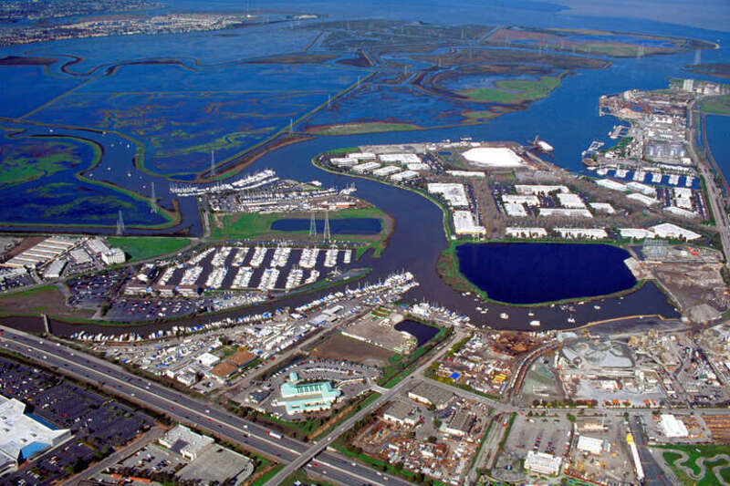 Aerial view of the port of Redwood City in San Mateo County, California, USA. The major deepwater port is visible at the far right in the photograph. Redwood Creek angles across the picture from lower left to upper right, forming the port and