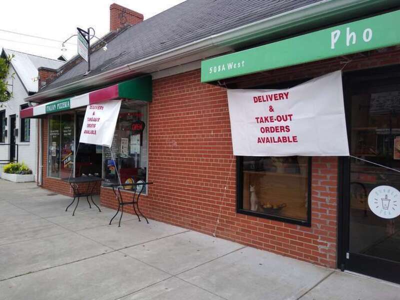 Two restaurants in Chapel Hill, North Carolina, in May 2020. They are open for delivery and take-out, but not dine-in service, due to the COVID-19 pandemic.