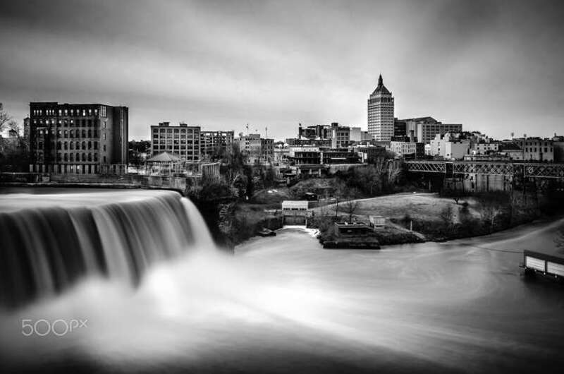 500px provided description: Rochester, NY is the headquater of the once photography empire, Eastman Kodak company. Now Kodak is struggling to survive. How time can change things!

The foreground is the high falls, the tower in distance is the Kodak
