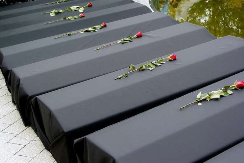 Roses placed on a row of replica coffins, representing soldiers that lost their lives in the Iraq War, at an anti-war protest held in front of the Women's Memorial at the entrance to Arlington National Cemetery.
More at The Schumin Web:
&amp;lt;a