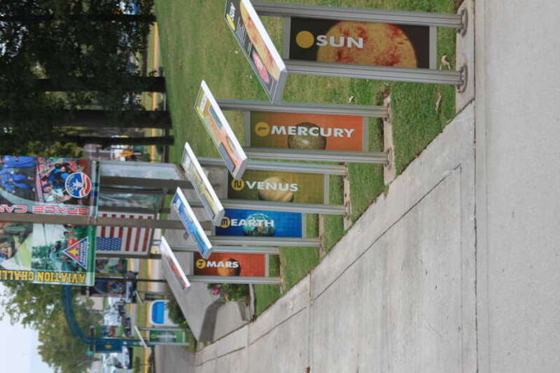 The walkway into the United States Space &amp;amp; Rocket Center includes a display for each planet (and the sun), stretching approximately 590 ft (180m) from the Sun to Pluto, spaced appropriately.  Hemispheres on each display represent the planets,