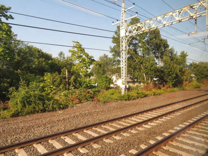Space for the long-removed fourth track visible on the New Haven Line in Milford, Connecticut in September 2018. The restoration of a section for the West Haven station project left the section through Milford as the only three-track section on the