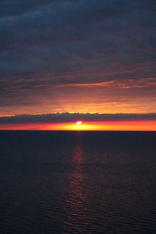 500px provided description: Sunset Over The Lake [#lake ,#red ,#sunset ,#reflection ,#blue ,#sun ,#orange ,#horizon ,#rays]