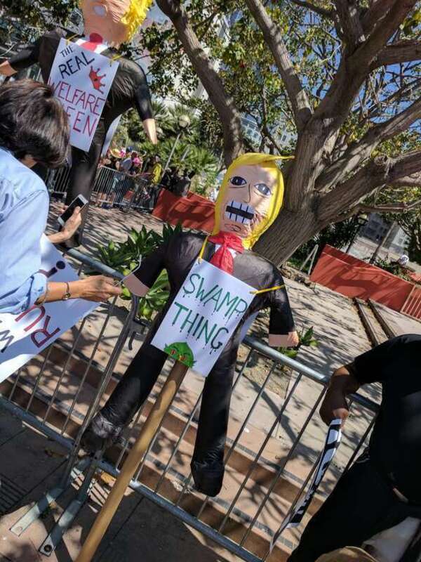 Swamp thing, sign, Tax March, Downtown Los Angeles, California, USA