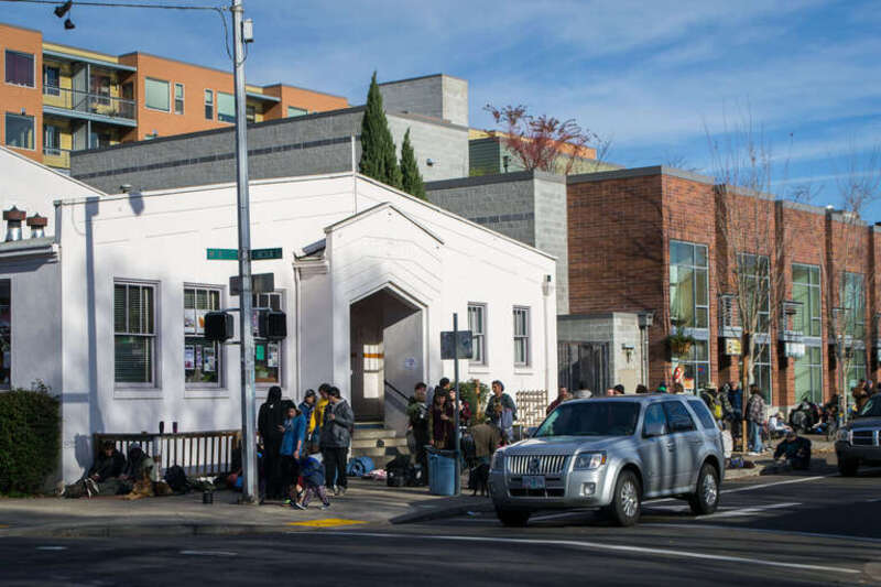 People arrive at the WOW Hall in Eugene, Oregon, for complimentary Thanksgiving dinner