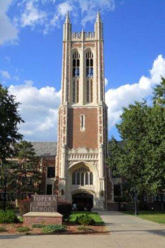 Topeka High School, showing the main entrance and bell tower, at 800 SW 10th Ave, Topeka, KS 66612. The bell tower plays Westminster chimes on the quarter hour.
