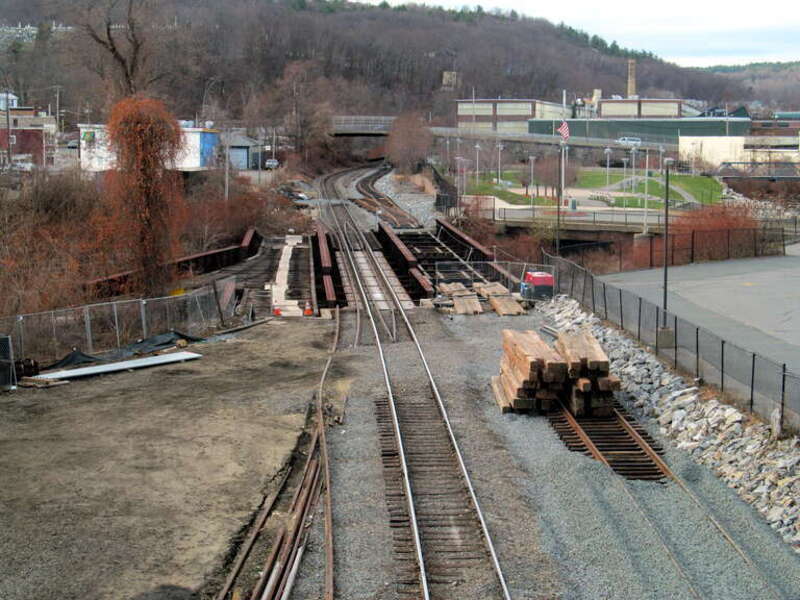 One of several railroad bridges over the Nashua River in Fitchburg, this one with an unusual arrangement - a switch to a former siding located on the bridge itself. Track work for the extension to Wachusett was under way on the right bays of the