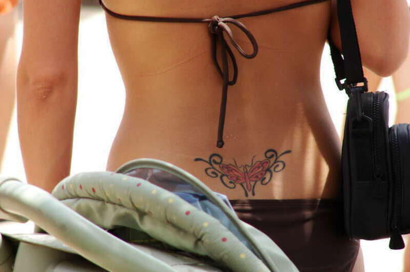 Lower back tattoo (&quot;tramp stamp&quot;).
