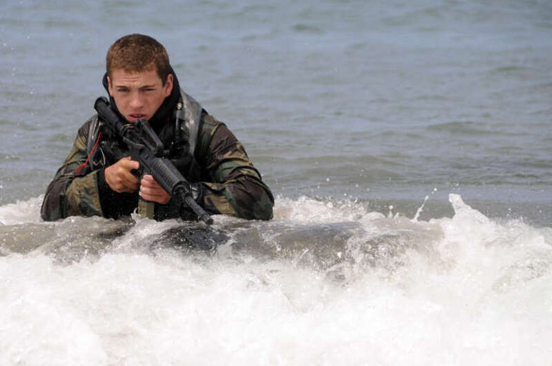 SAN CLEMENTE ISLAND, Calif. (June 24, 2009) A Basic Underwater Demolition/SEAL (BUD/S) student wades ashore on San Clemente Island during an over the beach exercise. The training is designed to prepare BUD/S students to conduct missions that begin in