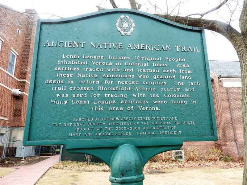 Looking west at sign in front of library
