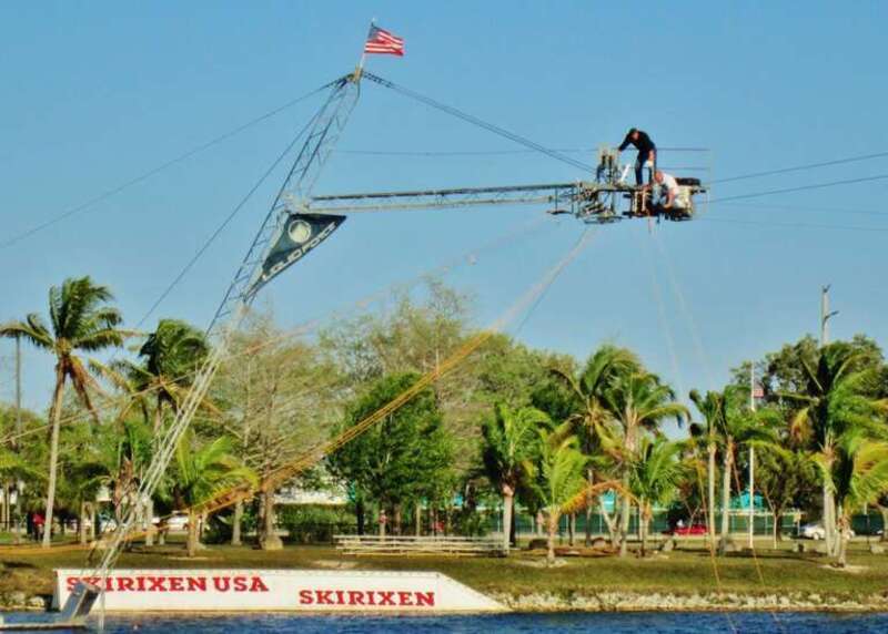 Way up over the water to repair the cable carrying the skiers on the lake, Quiet waters Park, Deerfield Beach