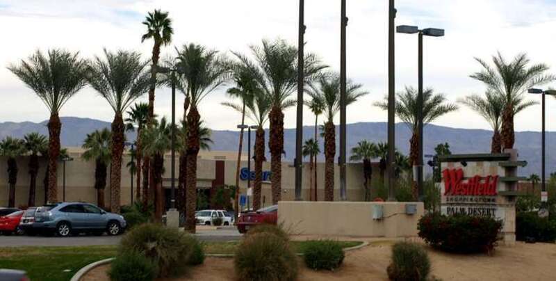 View of the main street entrance of the Westfield Palm Desert shopping mall with the Sears department store anchor in the background.  
View from southbound lane of CA SR 111, looking north northwest.
This photograph was taken with an Olympus E-510