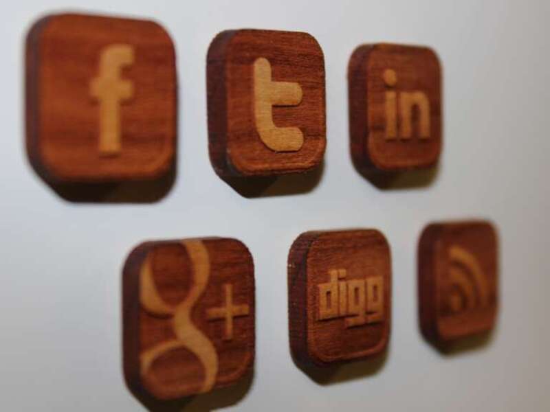 Social media icon magnets laser engraved and cut from cherry wood - Designed and created by Alan Reeves of Book Worm Laser